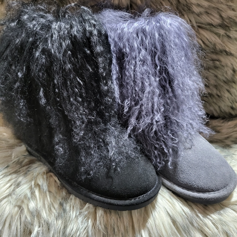 Women, black BearPaw Boo boots.
